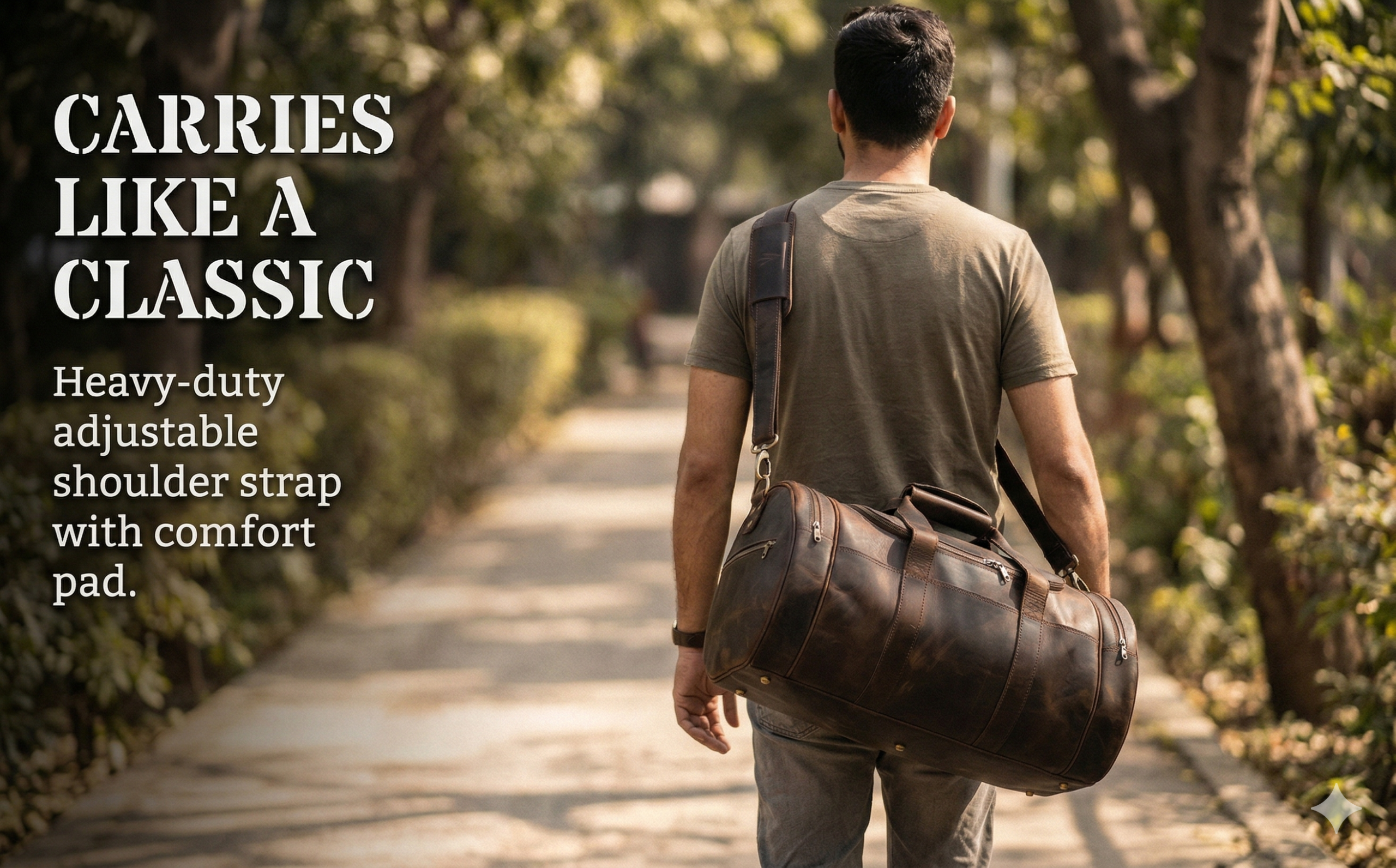 A man viewed from behind walking along a sunlit, tree-lined path, carrying a cylindrical dark brown leather duffle bag over his shoulder. Text on the left side reads "CARRIES LIKE A CLASSIC" followed by "Heavy-duty adjustable shoulder strap with comfort pad."